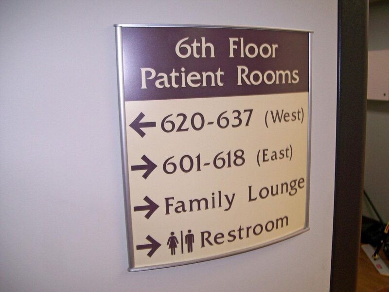 Curved Metal Directional Sign