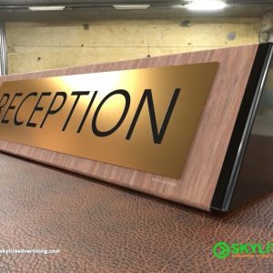 Engraved Brass Reception Sign on Wood